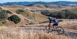 Young woman riding a Marin Team Marin 1 mountain bike, Sonoma County CA.