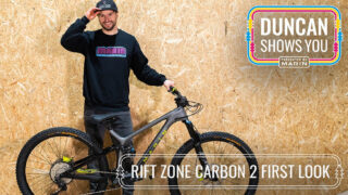 Bike rider Duncan Shaw stands with his Rift Zone bike